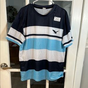 H49.    Striped Blue & White Athletic Tee with Eagle Logo